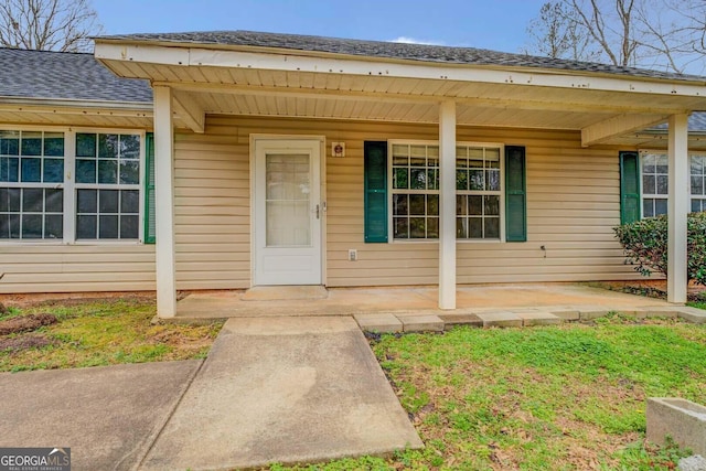 doorway to property featuring a porch