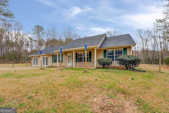 ranch-style house with a front lawn