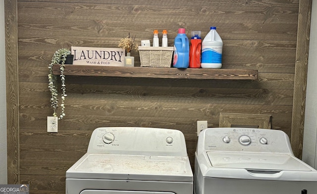 clothes washing area featuring washer and dryer