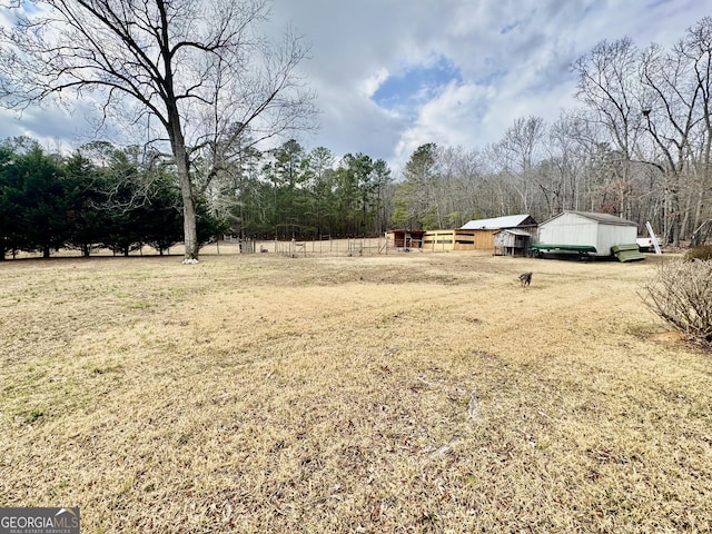 view of yard with a rural view