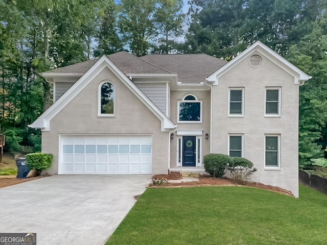 front facade featuring a garage and a front lawn