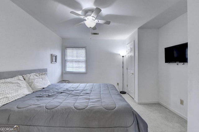 bedroom featuring light carpet and ceiling fan