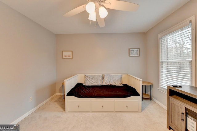 carpeted bedroom featuring ceiling fan