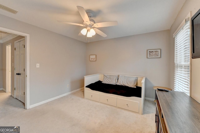 carpeted bedroom with ceiling fan