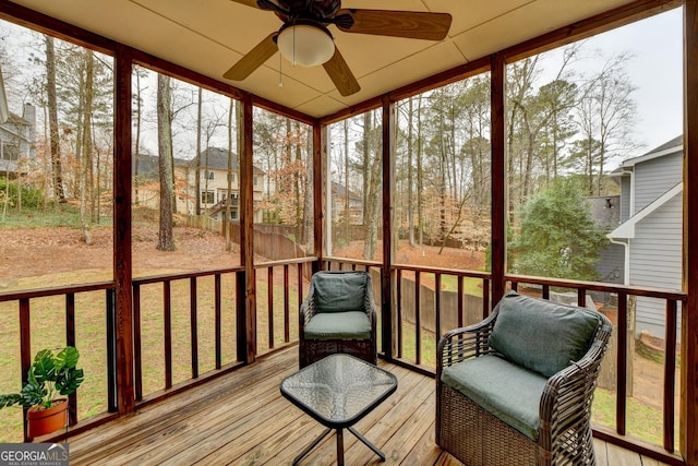 sunroom / solarium with ceiling fan