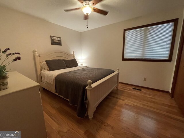 31 Hilltop Dr, Hayesville, NC 28904 - bedroom with dark wood-type flooring and ceiling fan