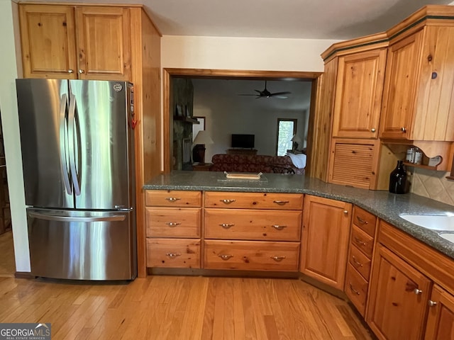 31 Hilltop Dr, Hayesville, NC 28904 - kitchen with light hardwood / wood-style flooring, stainless steel fridge, and dark stone countertops