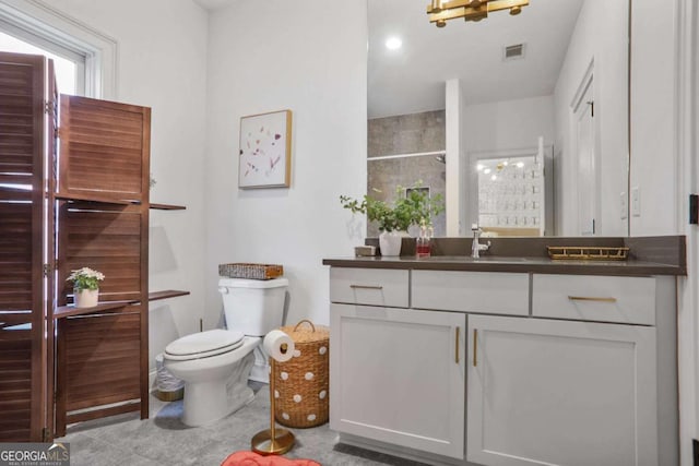 full bath featuring visible vents, toilet, and vanity