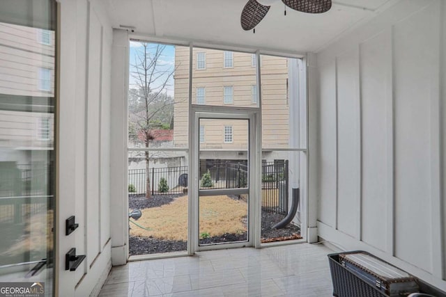 entryway featuring floor to ceiling windows and ceiling fan