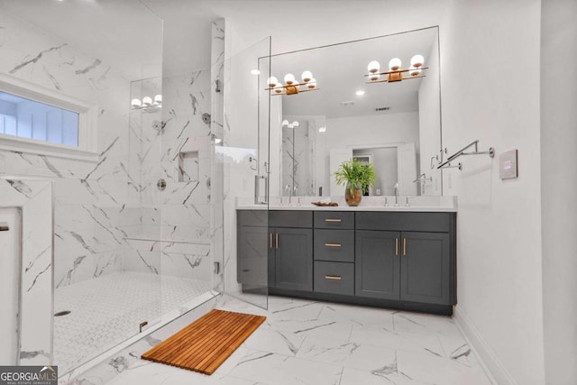 full bathroom with a marble finish shower, a sink, marble finish floor, and double vanity