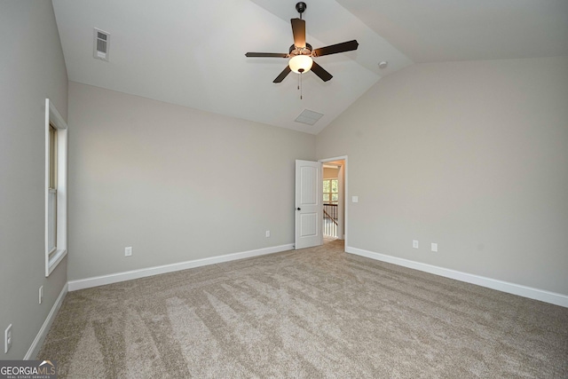 unfurnished room featuring high vaulted ceiling, ceiling fan, and carpet flooring