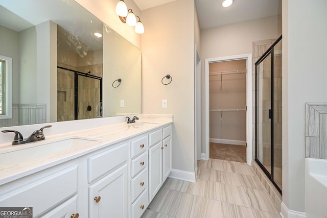 bathroom with vanity and an enclosed shower