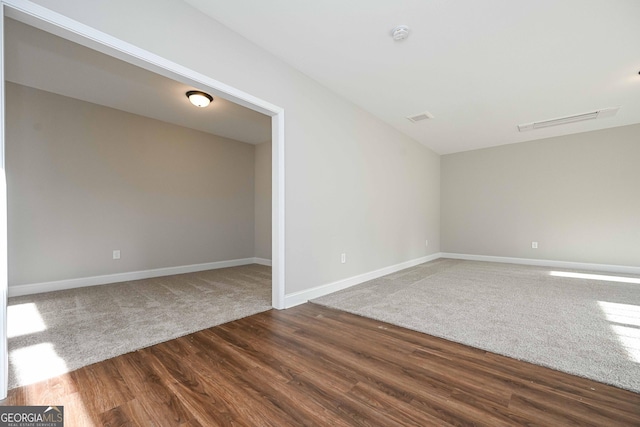 spare room with hardwood / wood-style floors