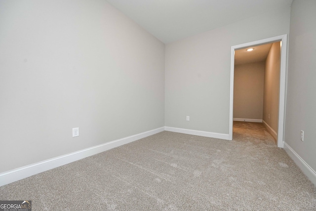 unfurnished room with carpet flooring