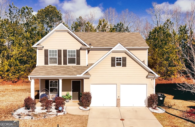 view of front of home featuring a garage and a porch