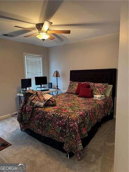 bedroom with carpet flooring and ceiling fan