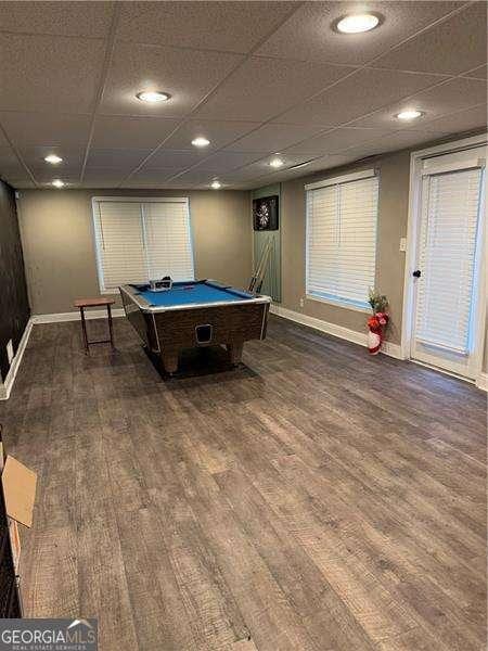 recreation room with a drop ceiling, hardwood / wood-style floors, and pool table