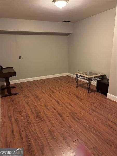 interior space with hardwood / wood-style flooring