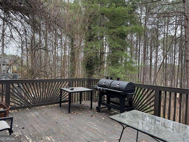 wooden deck with area for grilling