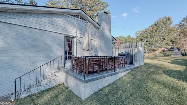 view of side of property with a yard