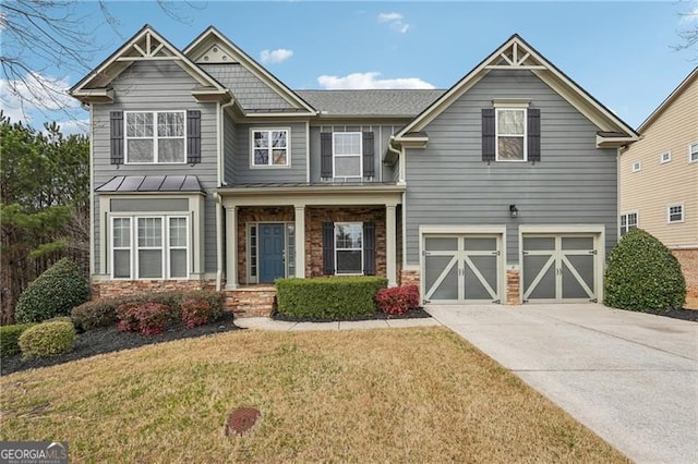 craftsman-style house with a garage and a front lawn