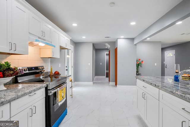 kitchen featuring tasteful backsplash, white cabinetry, light stone counters, and stainless steel electric range