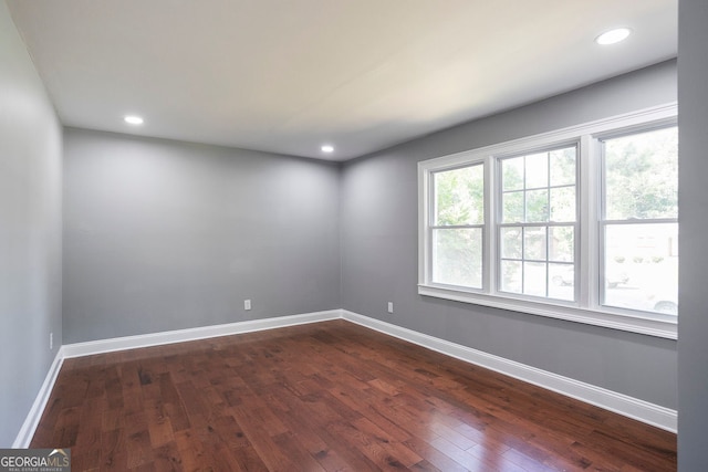 empty room featuring dark wood-type flooring