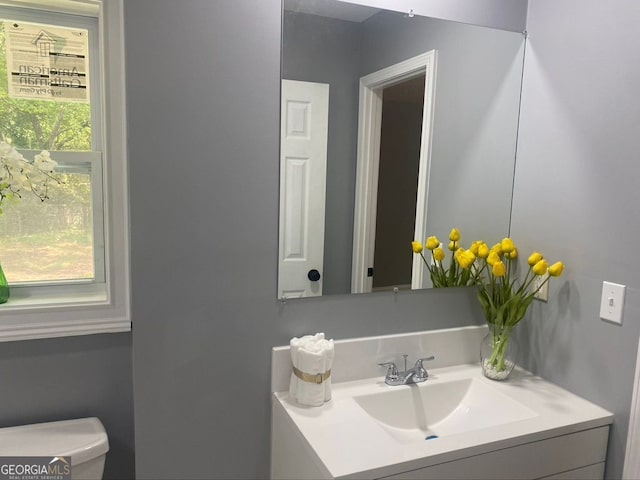 bathroom with vanity and toilet