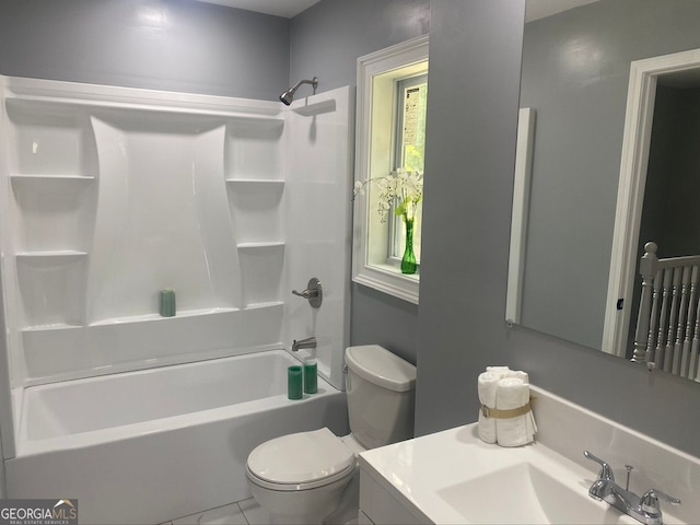 full bathroom featuring bathtub / shower combination, vanity, and toilet