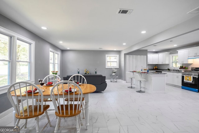 dining room featuring sink