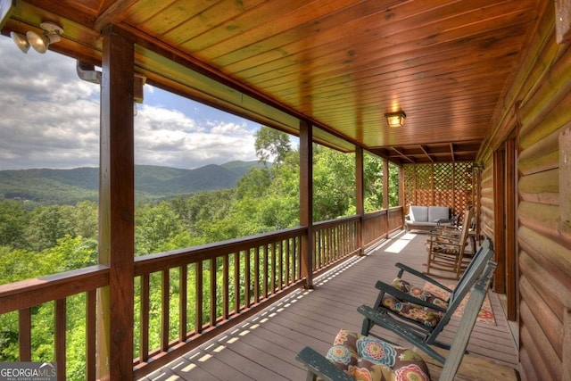 wooden deck featuring a mountain view