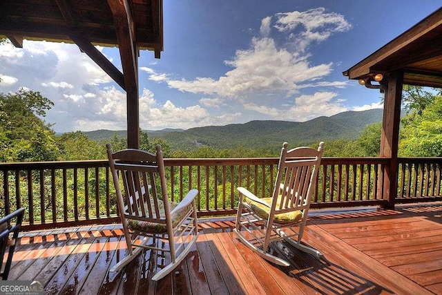 wooden terrace with a mountain view