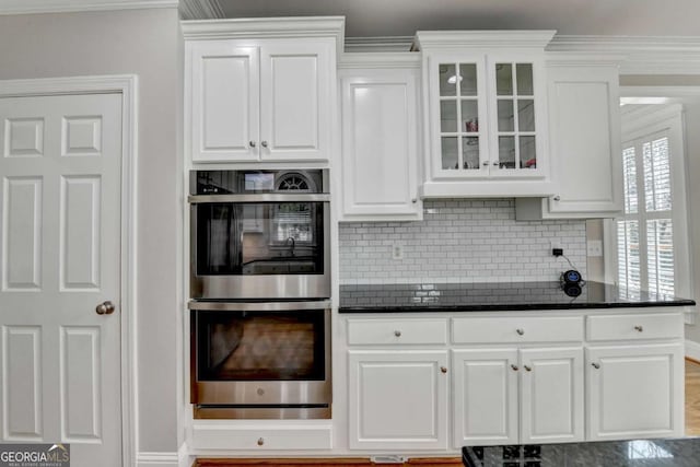 kitchen featuring white cabinets and stainless steel double oven