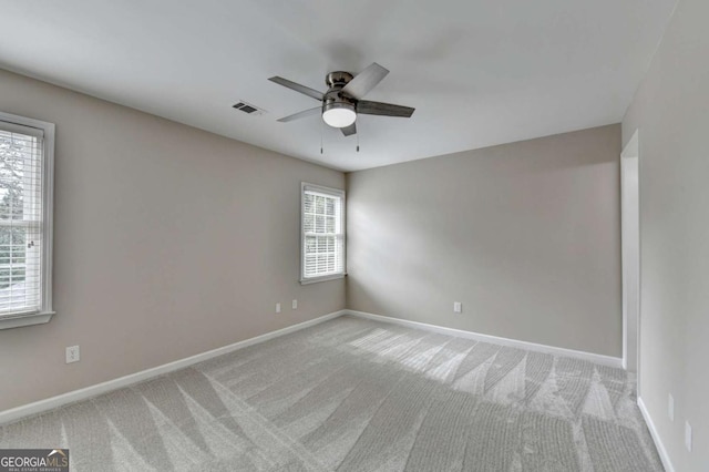 carpeted empty room with ceiling fan