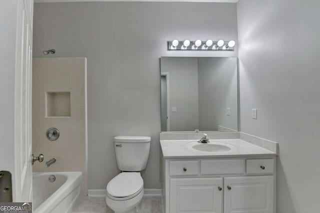 full bathroom with vanity, tiled shower / bath combo, and toilet