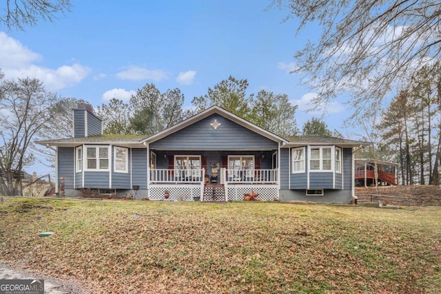 single story home featuring a front yard and covered porch