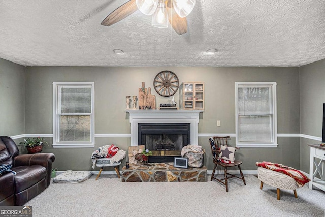 living room with carpet floors and ceiling fan