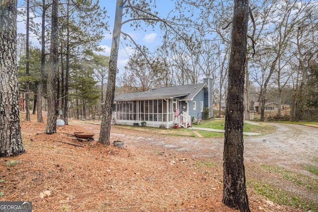 view of front of house featuring a sunroom