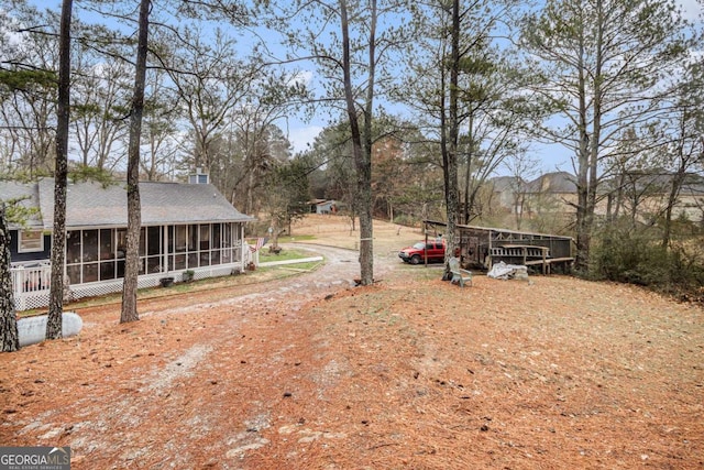 view of yard with a sunroom