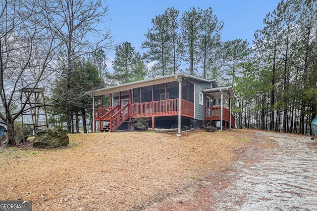 view of front of property with a sunroom