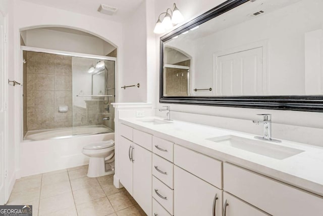 bathroom featuring visible vents, tile patterned flooring, a sink, and toilet