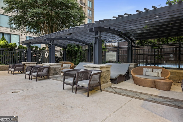 view of patio featuring fence and a pergola