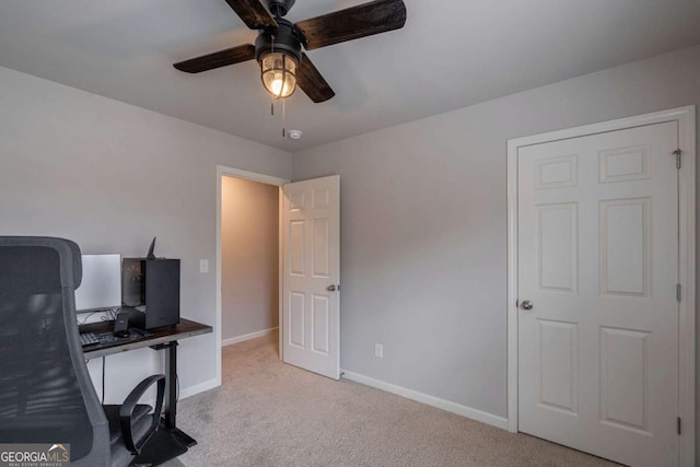 office featuring light colored carpet and ceiling fan