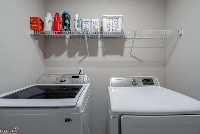 washroom featuring independent washer and dryer