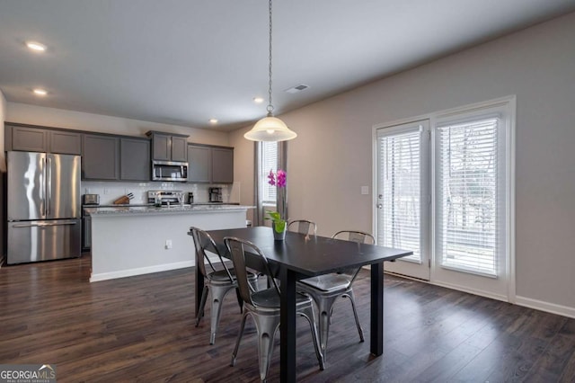 dining room featuring dark hardwood / wood-style flooring