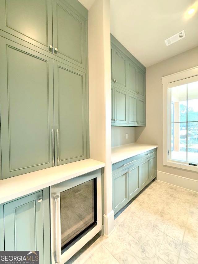 interior space with baseboards and visible vents