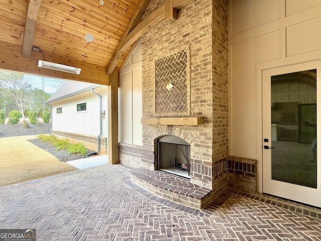 view of patio / terrace featuring an outdoor brick fireplace