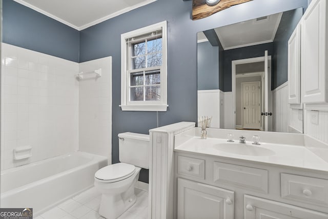 full bath with toilet, vanity,  shower combination, ornamental molding, and tile patterned floors