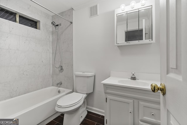 full bathroom featuring toilet, vanity, visible vents, baseboards, and  shower combination