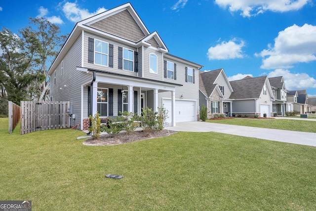 view of front of property with a garage, covered porch, and a front lawn